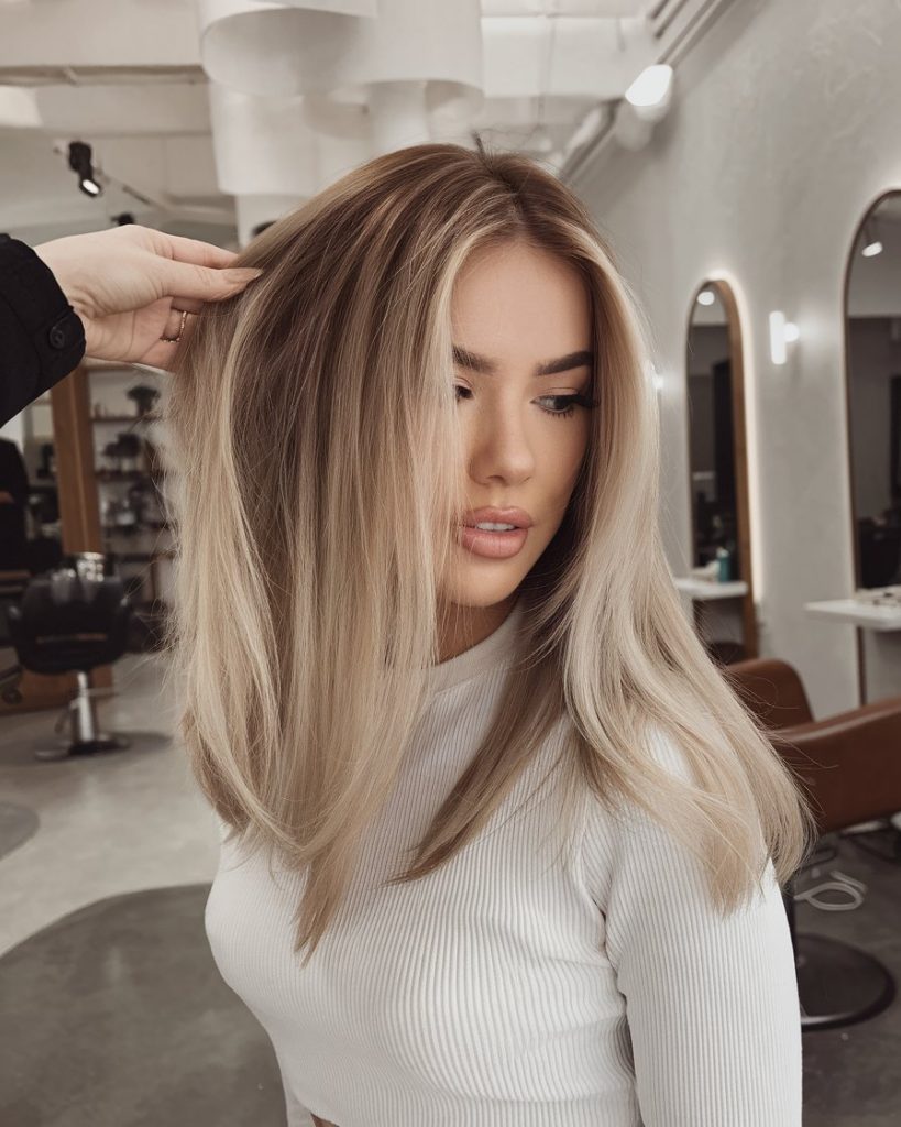 Mid-Length Blonde Balayage with a Side Part